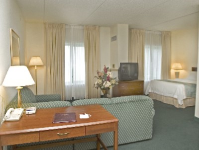 Large Well-lit Work Desk And Comfortable Sitting Area