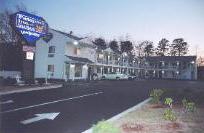 Passport Inn & Suites - Night Time Exterior View