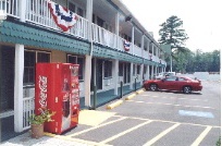 Americas Best Inn & Suites - Walkway-parking Lot