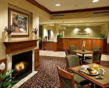 Hampton Inn & Suites - Breakfast Area-fireplace