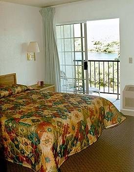 Suites Have Sliding Doors In Room That Overlook The River.