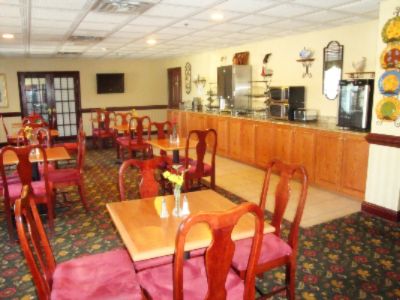 Relax In Our Breakfast Area With Complimentary Breakfast And Two Flat-screen Tvs