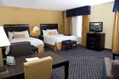 Hampton Inn & Suites - Suites Consist Of One Huge Room With 2 Queen Beds More Room To Spread Out Flat Panel Television Upholstered Chair And Sleep Sofa