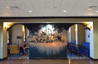 Hampton Inn & Suites - A Special Touch Is An Artist's Drawing Of Nature And Accented With Metal Art Of A Heron.