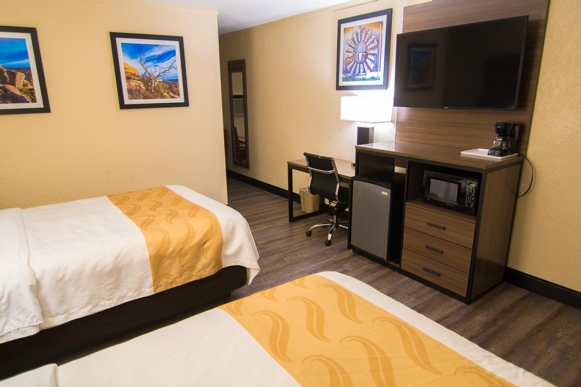 Quality Inn & Suites - Guest Room With Two Full Size Beds.