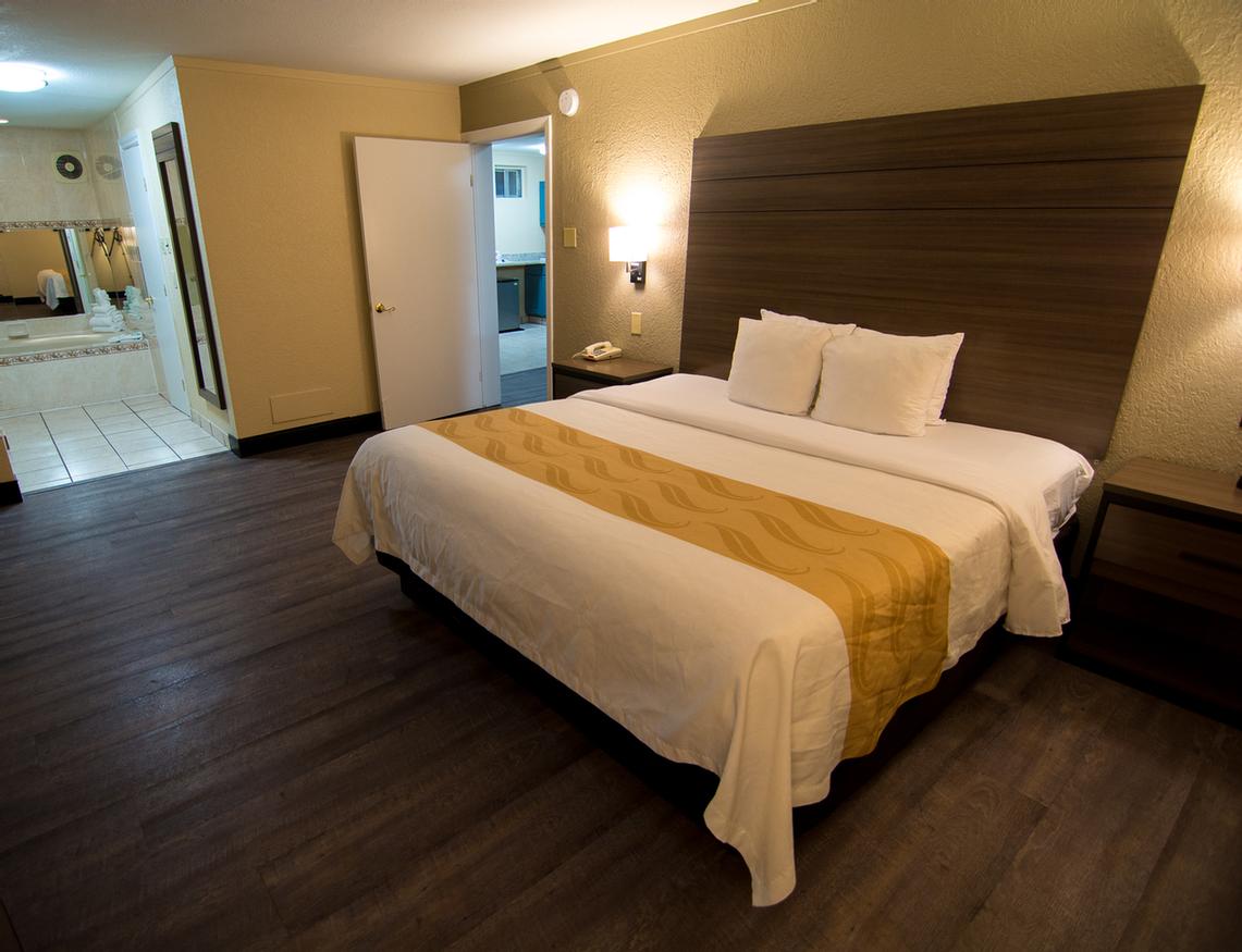 Quality Inn & Suites - Jacuzzi Suite Bedroom Area