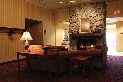 Howard Johnson Inn & Conference Center - Fireplace With Sitting Area