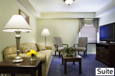 Patrick Henry Square / Inn & Suites - Suite Living Room