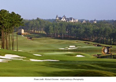 The Golf Course And Hotel In The Distance
