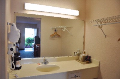 Super 8 Speedway - Hair Dryer And Coffee Maker In Room