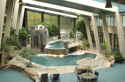 If You Can Picture Cascading Waterfalls A Massaging Jacuzzi A 2-story Indoor Swimming Pool Themed In A Smoky Mountain Setting And A Putt-puff Course By The Water You Are Enjoying The Glenstone Lodge’s Largest Indoor Pool Arena In The Smokies!