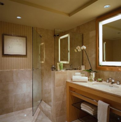 Luxurious Marble Bathroom Featuring Frette Bathrobes