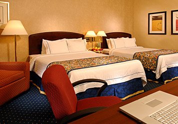 Tempe Downtown Courtyard by Marriott - Our Guest Room Features The Comfort Of Marriott Luxury Bedding In-room Coffee And Tea Iron Ironing Board Hairdryer And Loveseat.