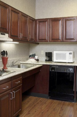 Kjitchen W/ Full Size Refrigerator Dish Washer And Stove Top.