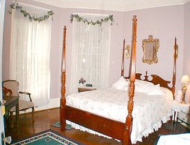 Purple Wisteria Rm w/poster bed.