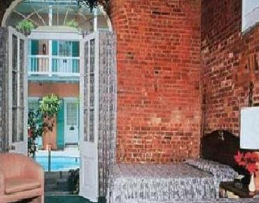 Poolside Guestroom with exposed brick