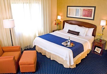Our King Guest Room Features The Comfort Of Marriott Luxury Bedding A Loveseat In-room Coffee And Tea An Iron Ironing Board Hairdryer And So Much More. With The Business Traveler In Mind There Is Complimentary High-speed Internet Access.