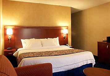 Our King Guest Room Features The Comfort Of Marriott Luxury Bedding In-room Coffee And Tea Iron Ironing Board Hairdryer And Loveseat.