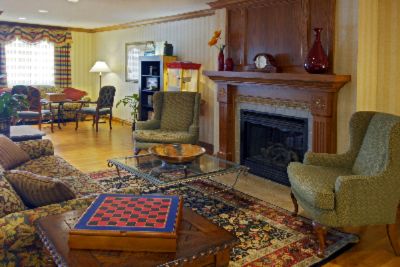 Country Inn & Suites Cedar Rapids Airport - Relax In Our Lobby And Enjoy A Book From Our Library