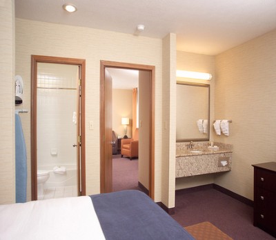 Suite Bedroom With View Into Living Room